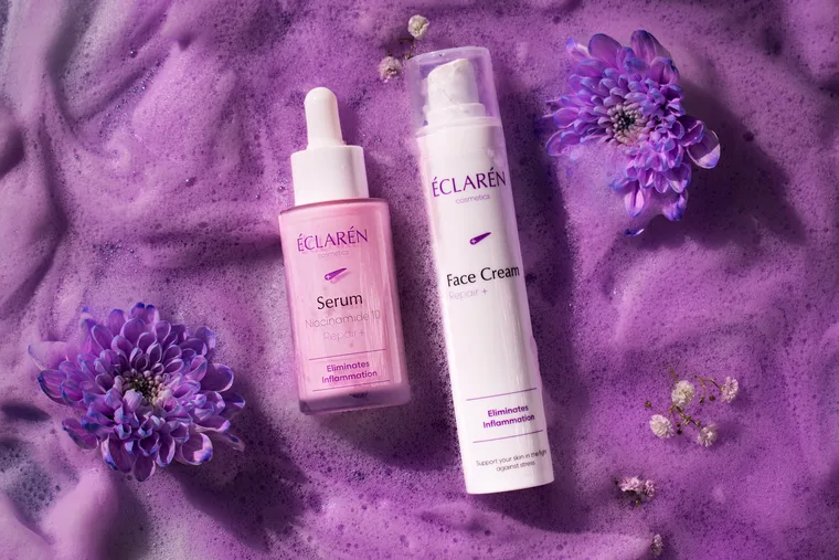 Éclarén: Serum and Face Cream lying in purple foam between chrysanthemums